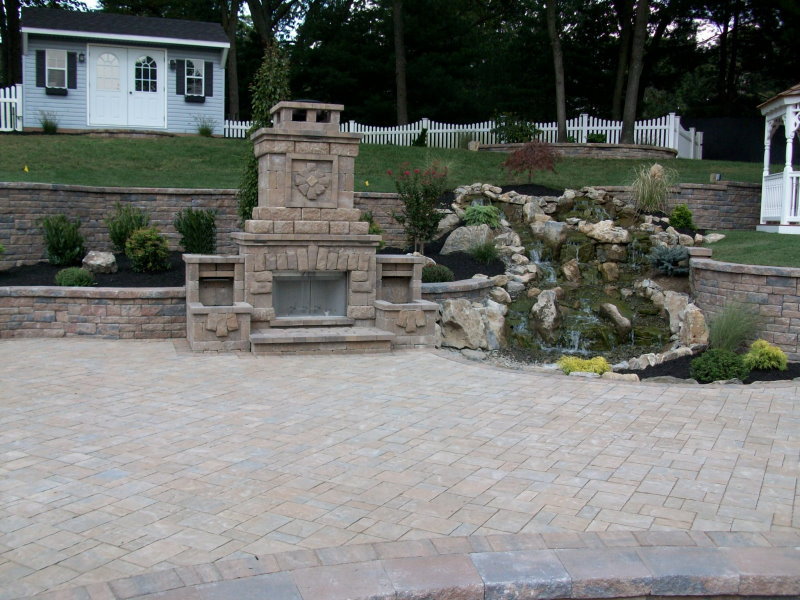 outdoor fireplace and waterfall